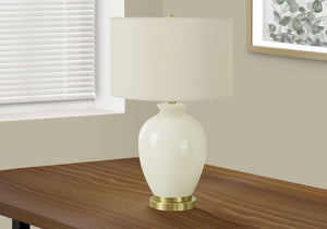 26" Gold and Ivory Ceramic Urn Table Lamp With Cream Drum Shade