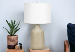 24" Beige Concrete Urn Table Lamp With Ivory Drum Shade