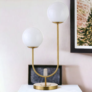 28" Gold Metal Two Light Novelty Table Lamp With White Globe Shade